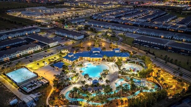 An aerial view of a resort with multiple swimming pools, a tennis court, and a variety of amenities. - 9-bedrooms ~ 25 Mins To Parks ~ Pool, Water Slides Hot Tub, Sauna, Mini Golf! (Davenport)