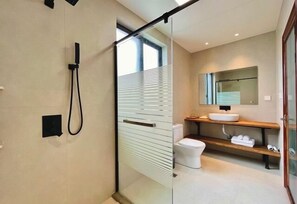 A modern bathroom with a glass shower enclosure, a white sink, and a wooden shelf. - Lexinghua Juzhusu (Taizhou Tiantai Guoqing Scenic Area Branch) (Tiantai County)