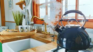 Fridge, microwave, stovetop, coffee/tea maker