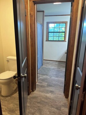 Shower, hair dryer, towels, toilet paper