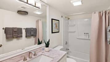 Shower, hair dryer, towels, shampoo