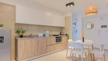 Microwave, coffee/tea maker, toaster, cookware/dishes/utensils