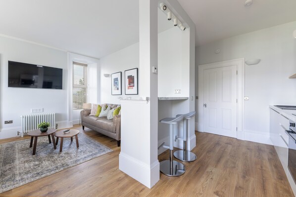 Apartamento superluxo, 1 quarto, vista para a cidade | Área de estar