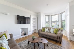 Apartamento superluxo, 1 quarto, vista para a cidade | Área de estar
