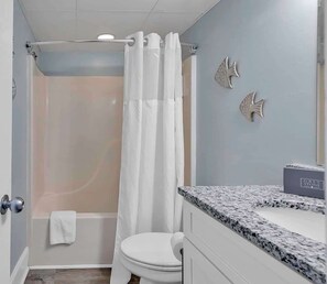 Shower, hair dryer, towels, shampoo