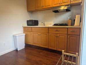 Fridge, microwave, stovetop, coffee/tea maker