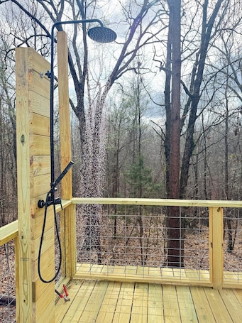 Property grounds. Secluded one bedroom cabin with large deck overlooking a wooded gully.