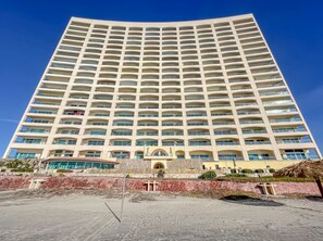 A tall, rectangular hotel with multiple balconies and a central entrance. - Penthouse-PrivateJacuzzi-MarYSolCondo-3BR-Rosarito (Playas de Rosarito)