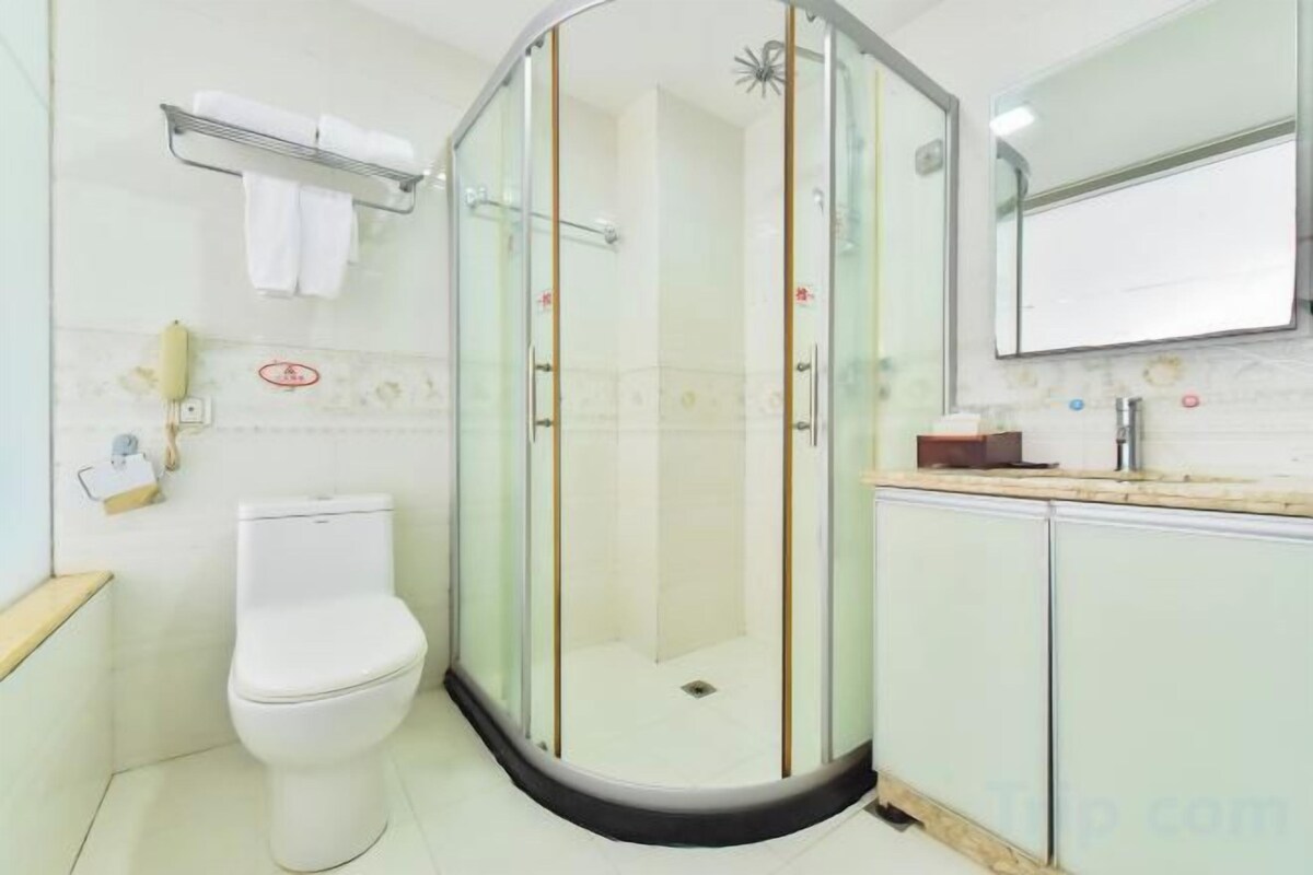 Shower, hair dryer, slippers, towels