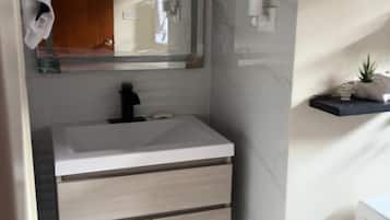 Shower, towels, soap, toilet paper