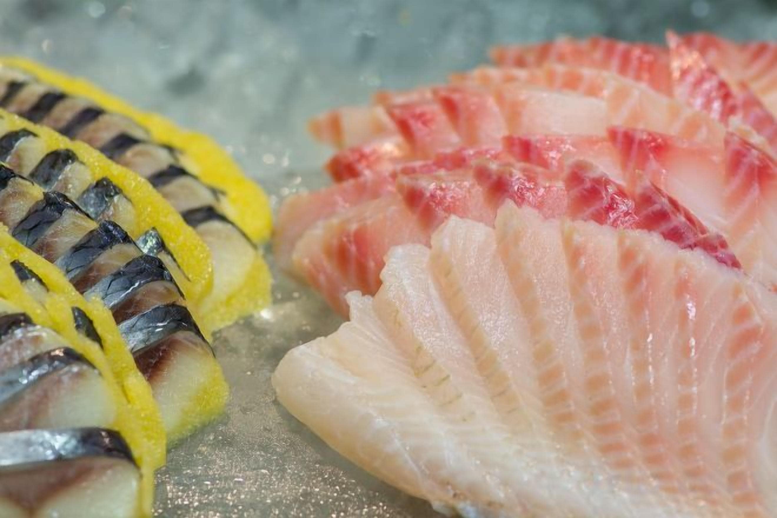 A selection of fresh seafood on a bed of ice.