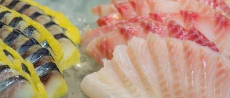 A selection of fresh seafood on a bed of ice.