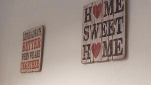 Two wooden signs with text on a wall. - Sweet BCN Studio with Terrace (Barcelona)