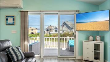 House, Multiple Beds, Balcony, Garden View (The Shore Thing) | Living area | 65-inch flat-screen TV with digital channels