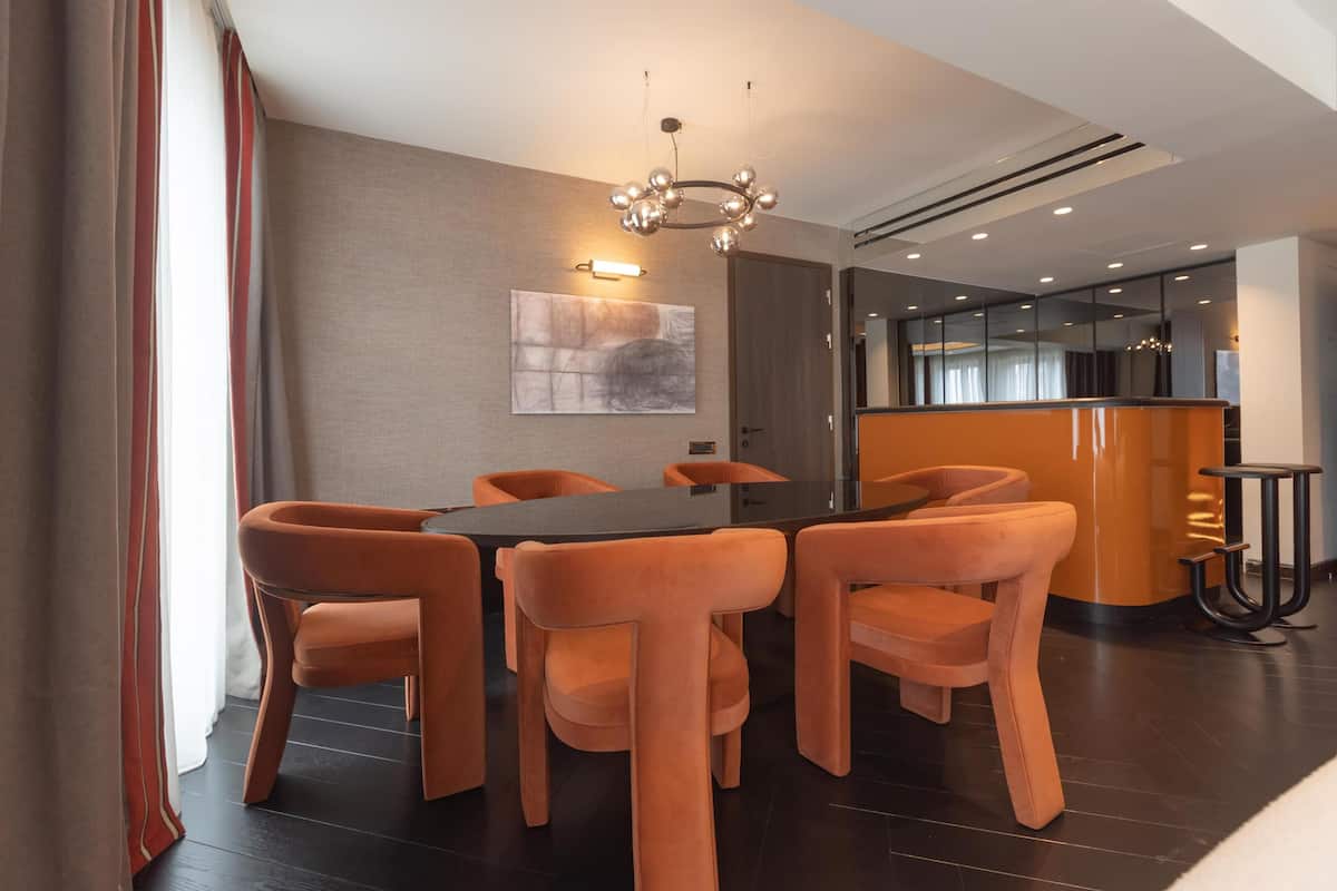 Suite, 1 King Bed | Living area | 55-inch flat-screen TV with cable channels