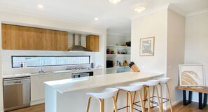 Fridge, coffee/tea maker, cookware/dishes/utensils