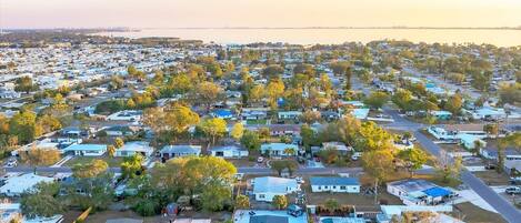 An aerial view of a residential area with houses and trees.
