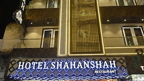 A multi-story hotel with illuminated signage reading "HOTEL SHAHANSHAH RESTAURANT". - Hotel Shahanshah & Restaurant (Ajmer)