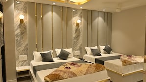 A hotel room with two beds, a marble wall, and a modern design. - Hotel Shahanshah & Restaurant (Ajmer)