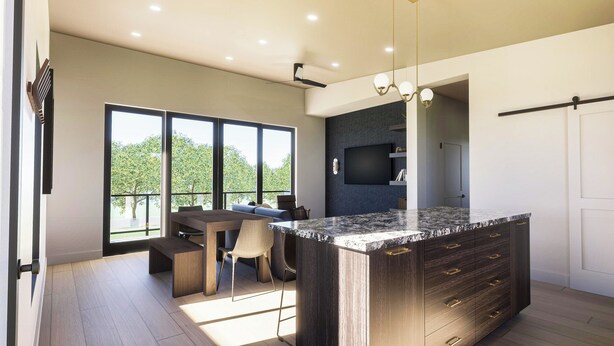 A modern kitchen with a large island, built-in appliances, and a dining area with a view. - Experience Elegance at the Montclair in Our Luxury Villa (Springdale)