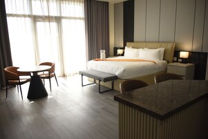 Junior Master Suite | Living area | 50-inch flat-screen TV with digital channels