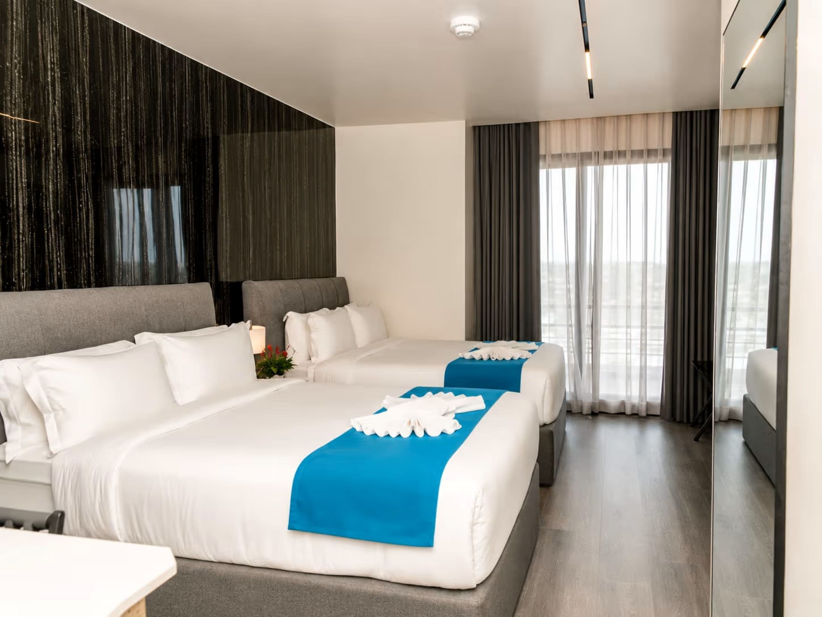 Deluxe Double Queen | Tempur-Pedic beds, in-room safe, blackout drapes, soundproofing