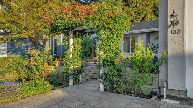 A residential garden with a stone pathway leading to a house entrance. - Japandi Garden Home/Jacuzzi/Game Room/BBQ/Fire pit (San Jose)