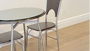 A room with a round glass table and two metal chairs. - Beautiful place with Kitchen, Washing Machine, Internet near UBC, beach and DT (Vancouver)