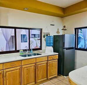 Fridge, microwave, stovetop, coffee/tea maker