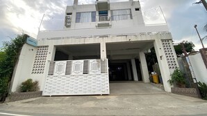 A two-story building with a gated entrance, a balcony on the upper floor, and a sign indicating "JESUS AVENUE." - Ranls Dream Syari'Ah Banda Aceh (Banda Aceh)
