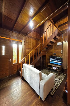 Villa Deluxe | Área de sala de estar | Televisión de pantalla plana 