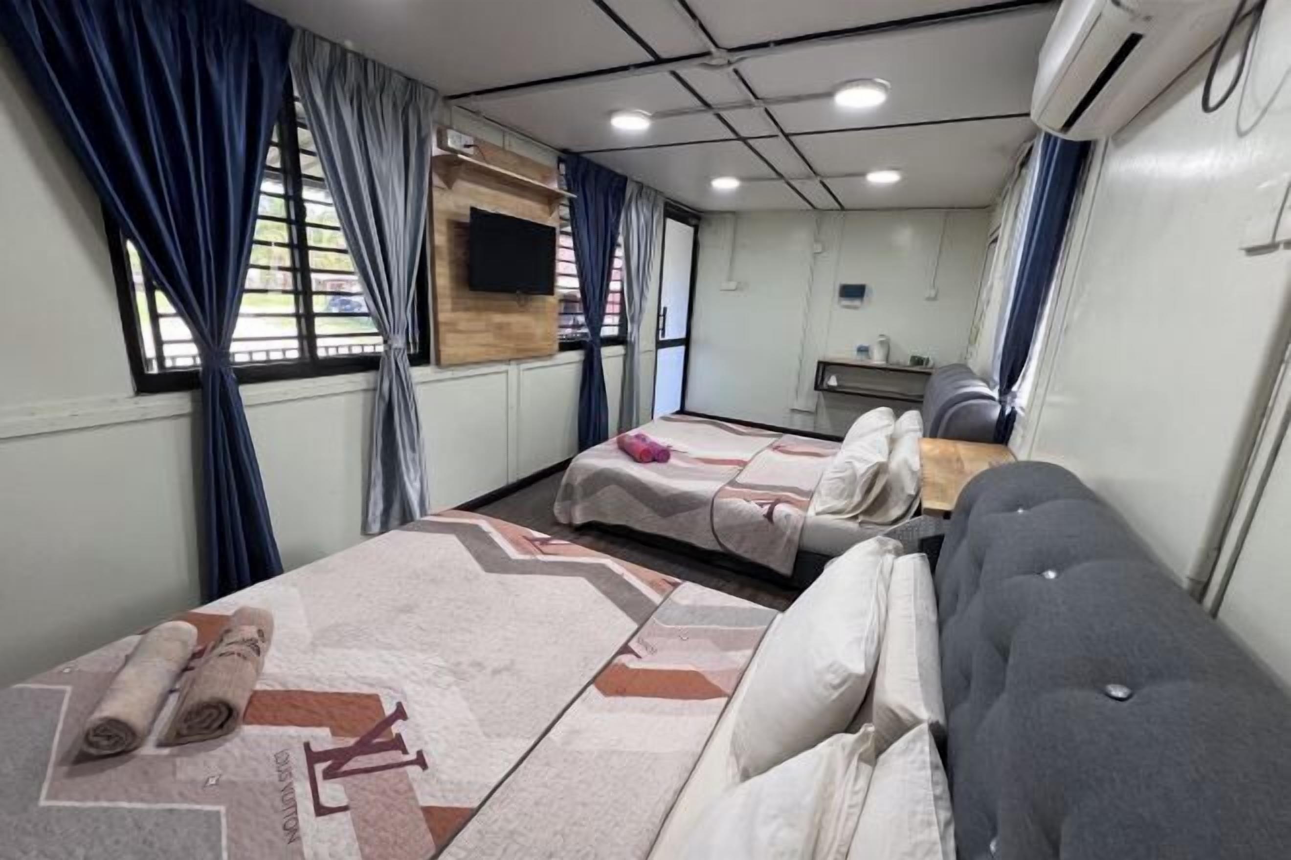 Desk, iron/ironing board, bed sheets