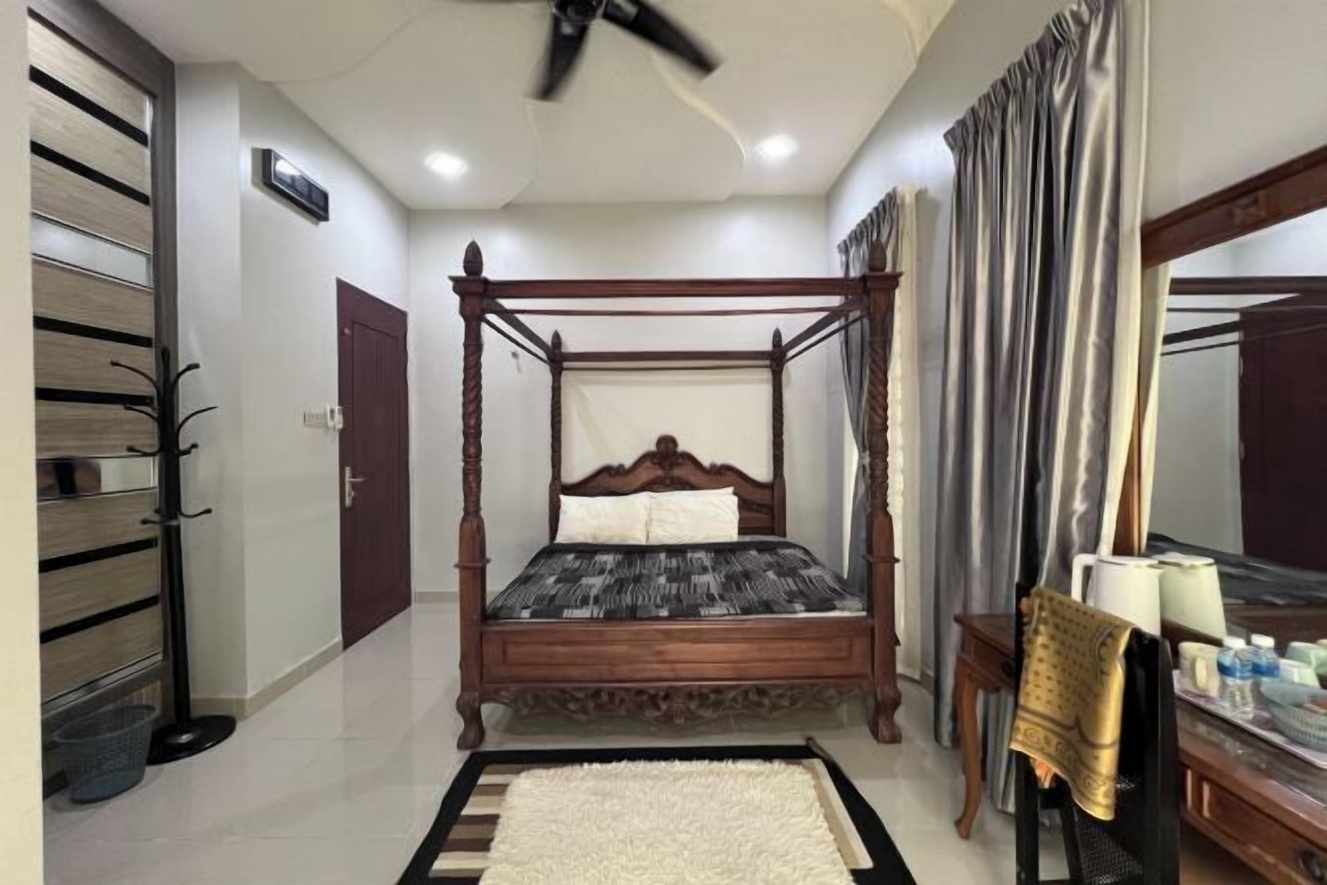 Desk, iron/ironing board, bed sheets