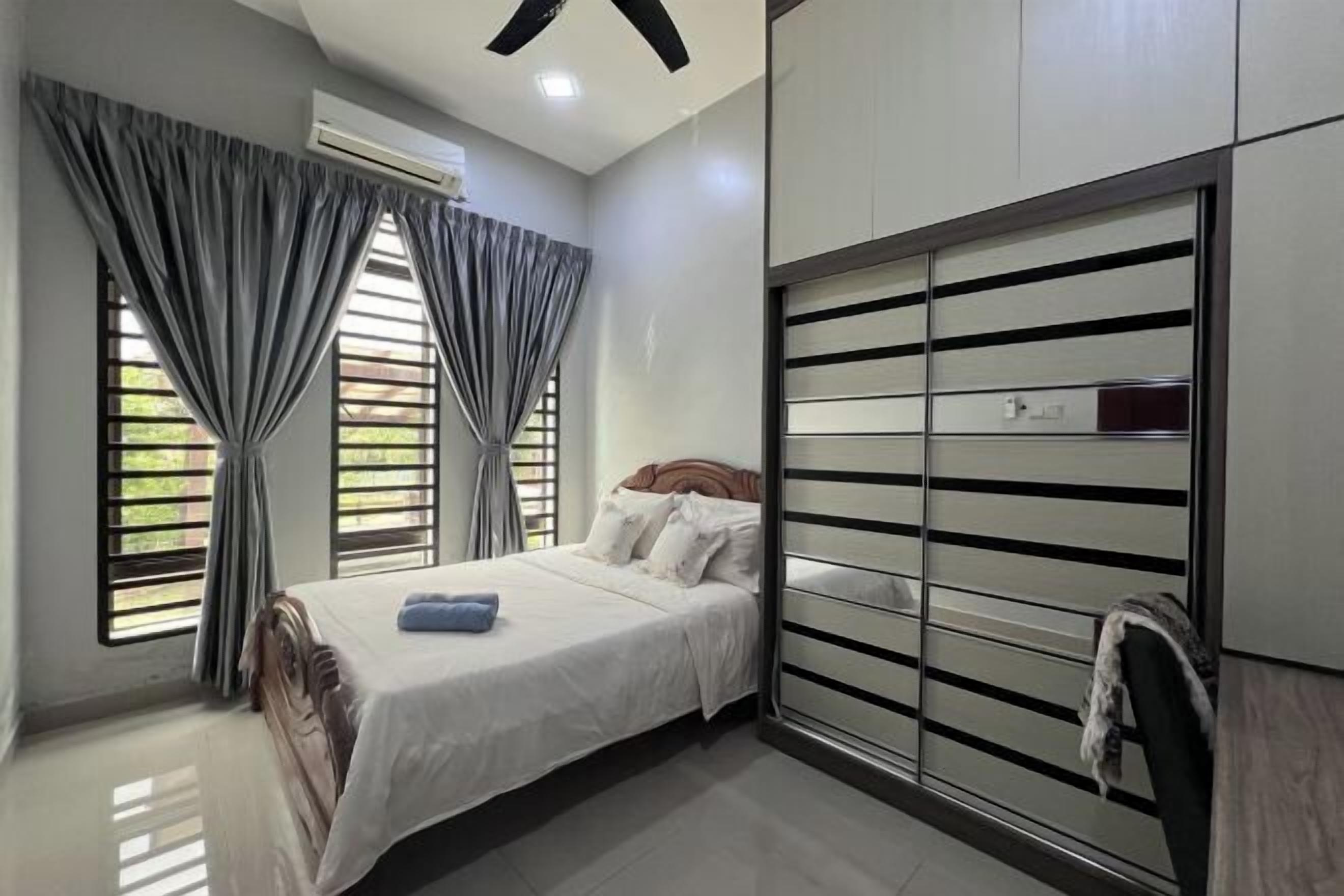 Desk, iron/ironing board, bed sheets