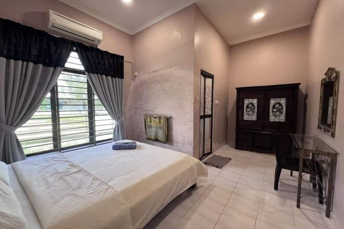 Desk, iron/ironing board, bed sheets
