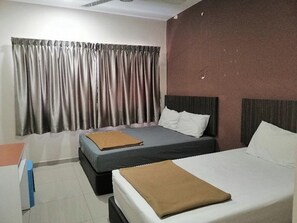 A hotel room with two beds, a desk, and a window with curtains. - JS Hotel, Johor Bahru (Johor Bahru)