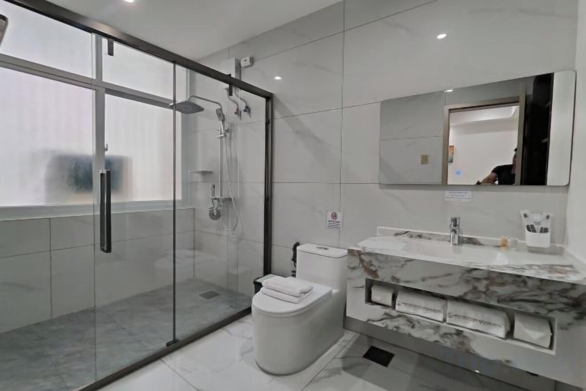 Shower, slippers, towels, soap