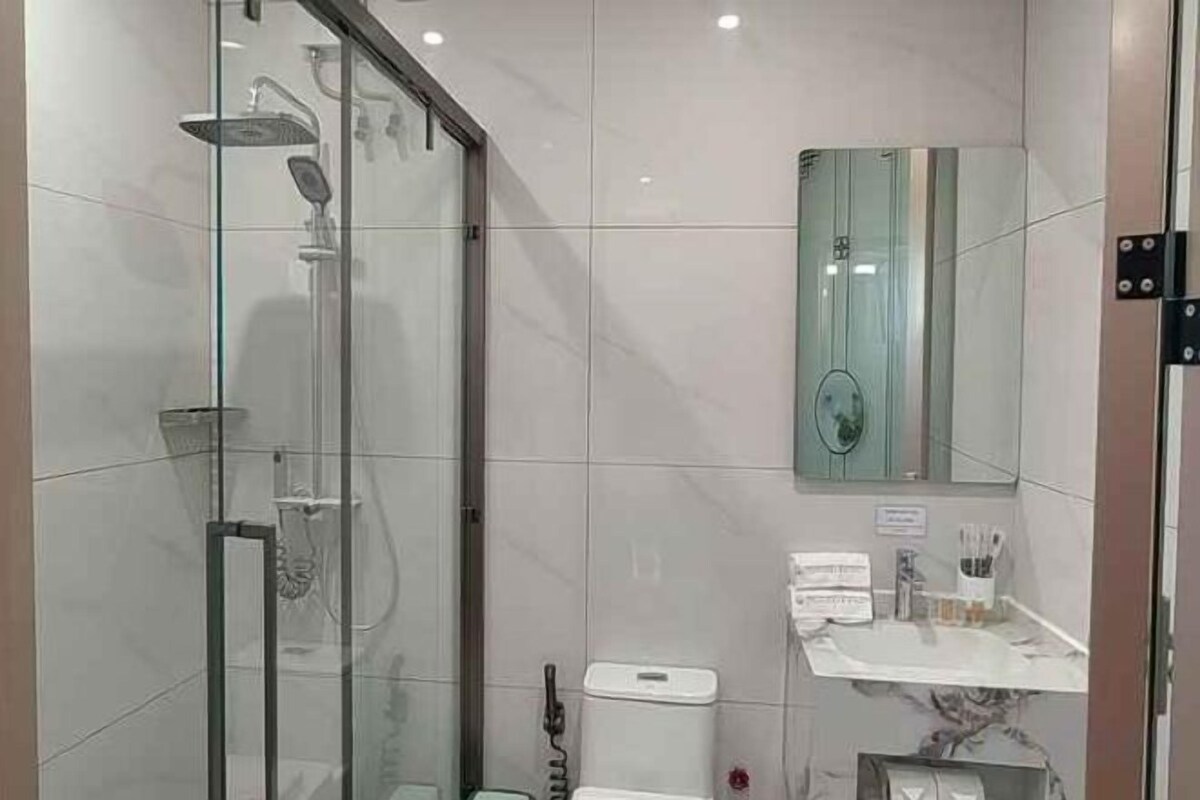 Shower, slippers, towels, soap