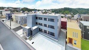 A modern building with a flat roof, multiple windows, and a flat facade. - Crystalcourt Shirahama (Shirahama)