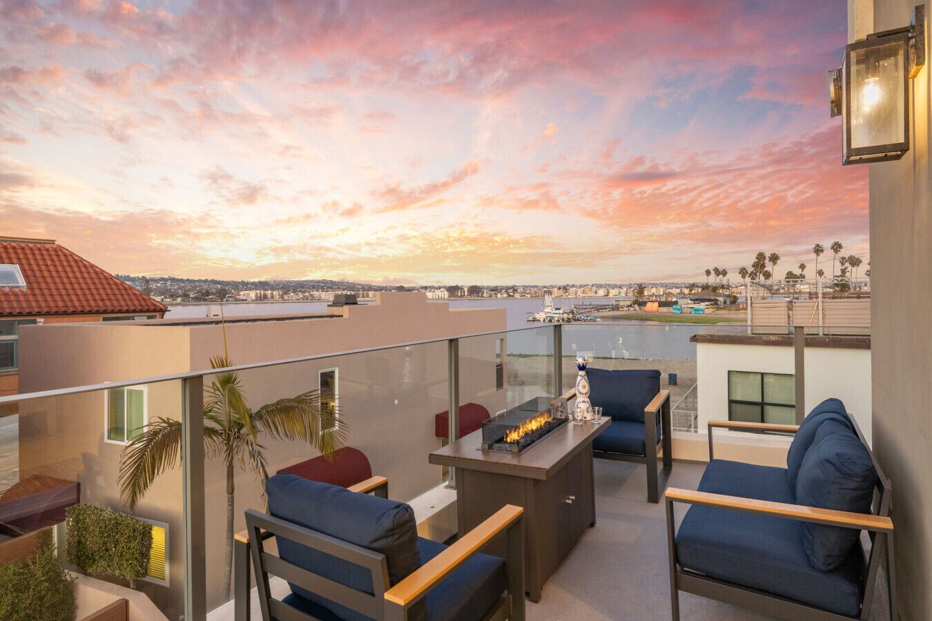 Top floor balcony with fire pit and seating area