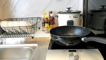 Cozy King Room with Kitchen | Private kitchen | Fridge, cleaning supplies