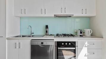 Coffee/tea maker, fridge, microwave, oven