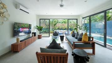 Deluxe Villa, Pool View | Living area | 60-inch Smart TV with digital channels