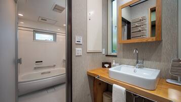 Separate tub and shower, free toiletries, slippers, towels