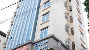 A multi-story building with a massage center on the ground floor. - Duc Trung Hotel CB by Bayluxury (Thuc Phan)