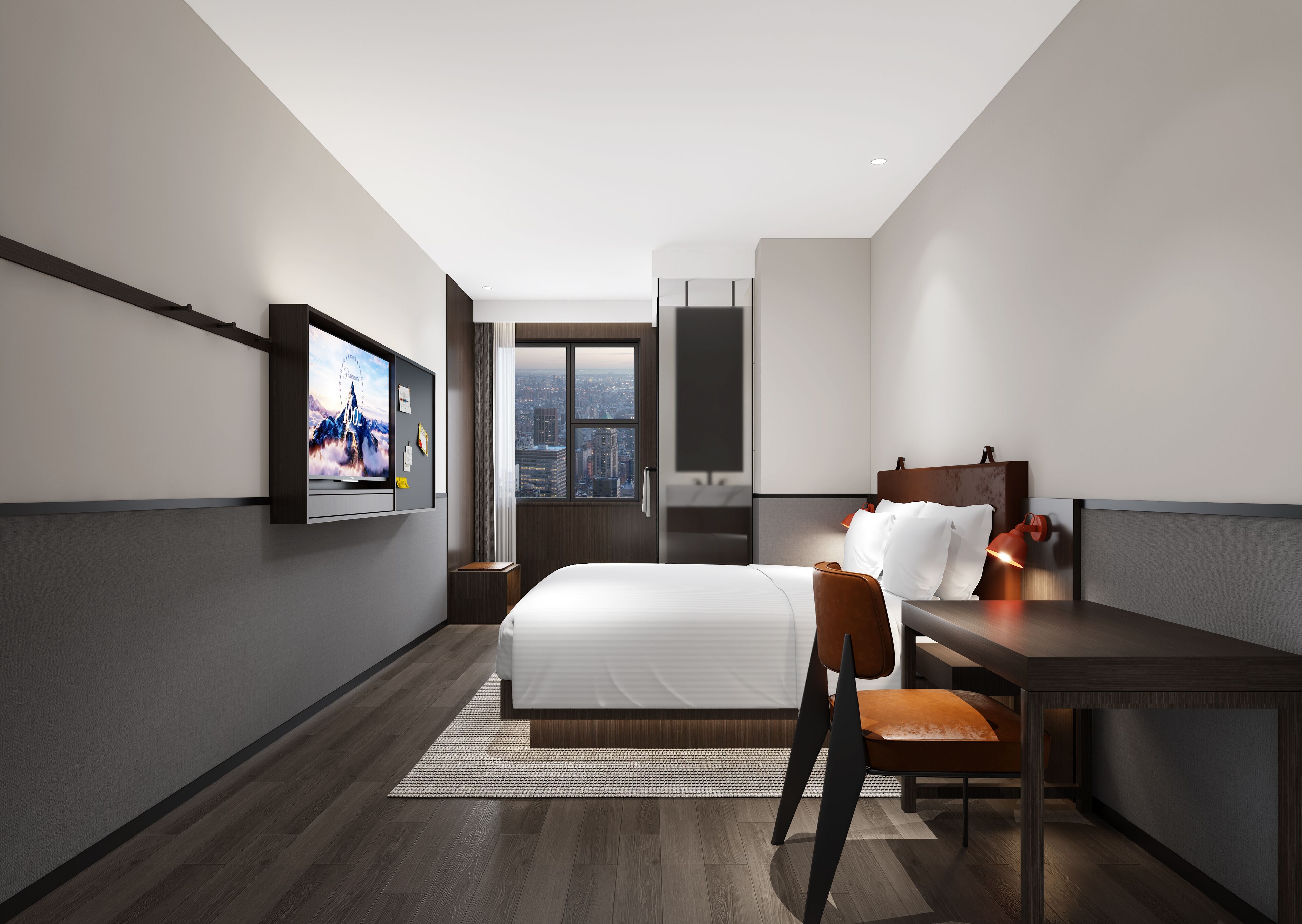 Una habitación de hotel moderna con una cama grande, un escritorio, una silla y un televisor montado en la pared.