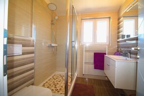 Shower, hair dryer, towels, soap