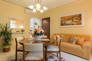 Basic Apartment, Patio, Garden View | Living area | 20-inch Smart TV with satellite channels