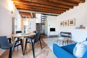 Deluxe Apartment, Patio, Lake View | Living area | 20-inch TV with digital channels