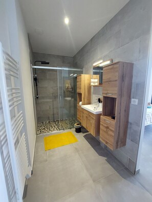 Shower, hair dryer, towels, soap